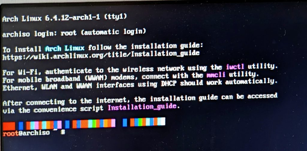 Photo of an interactive shell showing the starting message of the Arch Linux 6.4.12-arch1-1 tty1